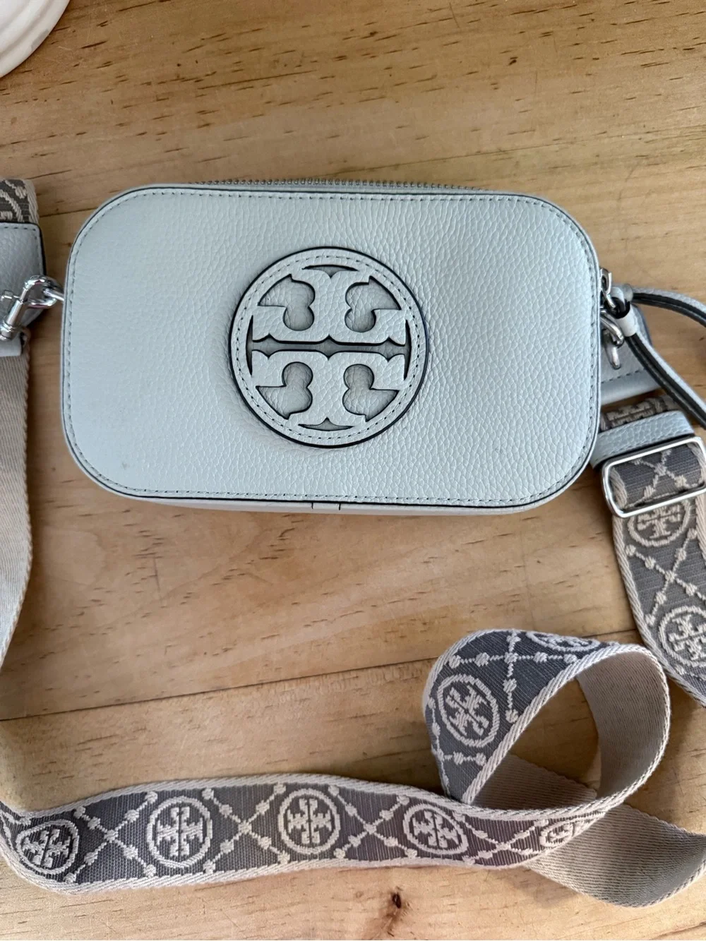 Tory Burch Pebbled Light Gray Leather Camera Crossbody with Patterned Logo Strap